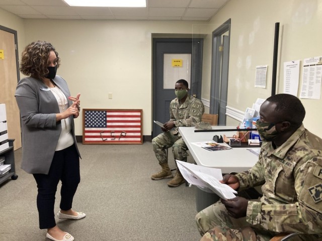 Veronica Ashford, Career Skills Program counselor, talks to Sgt. William Slade and Sgt. Ibrahim Kargbo, both assigned to 550th Engineer Detachment, 887th Engineer Support Company, 326th Engineer Battalion, 101st Division Sustainment Brigade, 101st Airborne Division (Air Assault), about career programs April 22 at the new office for the Career Skills Program, 5663 Screaming Eagle Blvd., next door to the Transition Assistance Program.