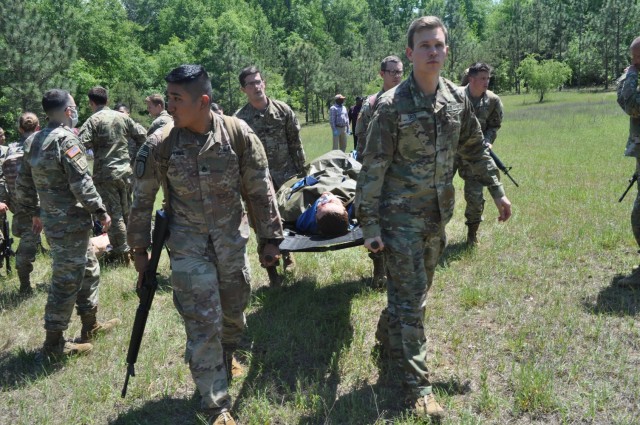 Doctors from Martin Army Community Hospital's Family Medicine Residency Program evacuate a casualty during an exercise at the Medical Simulation Training Center as part of their 3-day operational medicine course, Family Medicine Residency Experience.