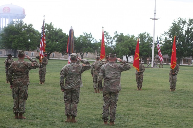 Brigs. Gen. Thomas Moore, Frank Rice, and Phil Brooks salute the flag during a retreat ceremony April 28, 2021, in their honor at Fort Sill, Oklahoma, on the Old Post Quadrangle.