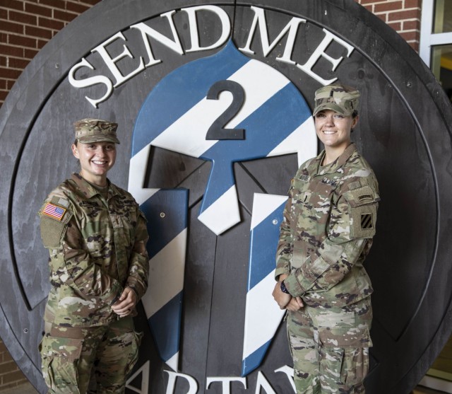 1st Lt. Trisha M. Burden(right) and 2nd Lt. Amanda D. Atkinson(left) with 2nd Armored Brigade Combat Team, 3rd Infantry Division, pose for a team photo at the brigade headquarters April 26, 2021 on Fort Stewart, Ga. The First All-Female Sapper...