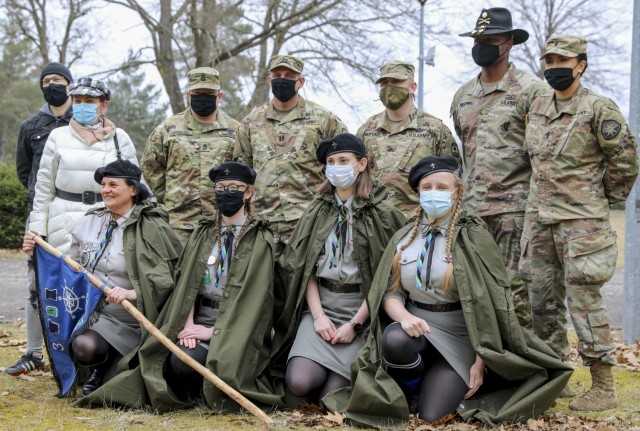 Major Marcellus Simmons, public affairs officer 1st Armored Brigade Combat Team poses with 361st Civil Affairs Brigade, 50th Regional Support Group soldiers, a local Polish Girl Scout Troop and polish citizens during the commemoration of “The...
