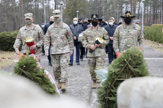 Colonel Ryan Hanson, commander 1st Armored Brigade Combat Team and Command Sergeant Major Calvin Hall, command sergeant major 1st Armored Brigade Combat Team walk alongside Colonel Ricardo Roig, commander 50th Regional Support Group and Command...