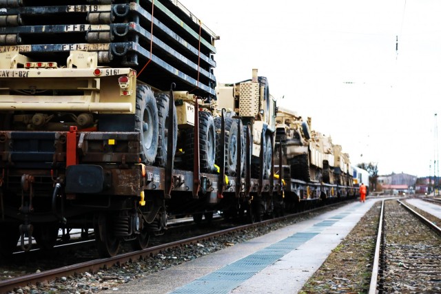 Armored vehicles assigned to the 1st Armored Brigade Combat Team, 1st Cavalry Division, sit on railcars at Parsburg, Germany, in preparation for transfer to Poland, Mar. 11, 2021.