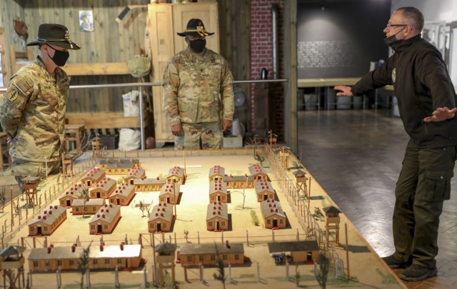 Colonel Ryan Hanson, commander 1st Armored Brigade Combat Team and Command Sergeant Major Calvin Hall, command sergeant major 1st Armored Brigade Combat Team tour Muzeum Obozow Jenieckich Prisoner of War Camps Museum, Stalag Luft III during the...