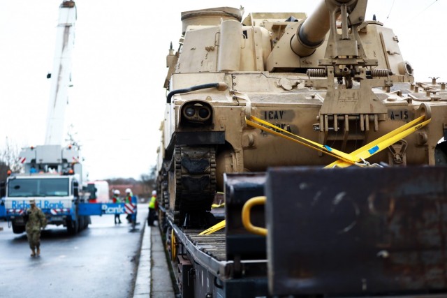 An M109 Paladin assigned to the 1st Armored Brigade Combat Team, 1st Cavalry Division, sits on a railcar in preparation for transfer to Poland at Parsburg, Germany, Mar. 11, 2021.