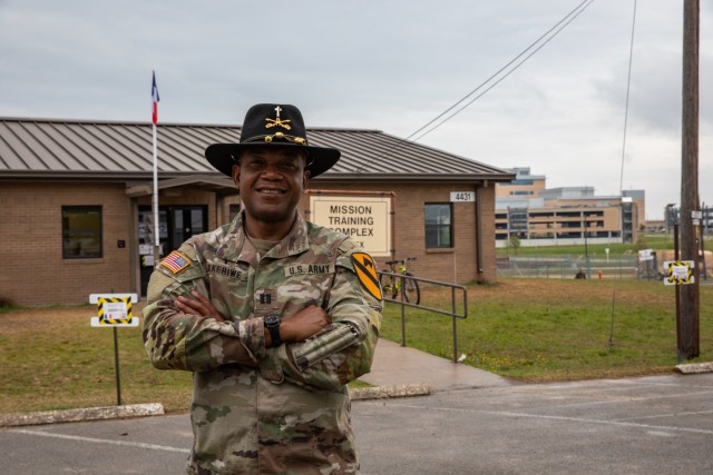Capt. Raymond Akirewe, a chaplain with 1st Cavalry Division, poses outside the French Living Area at Fort Hood, Texas, April 4, 2021. Akirewe, an ordained Catholic priest, hails from Ghana, a francophone nation in west Africa. (U.S. Army photo by...