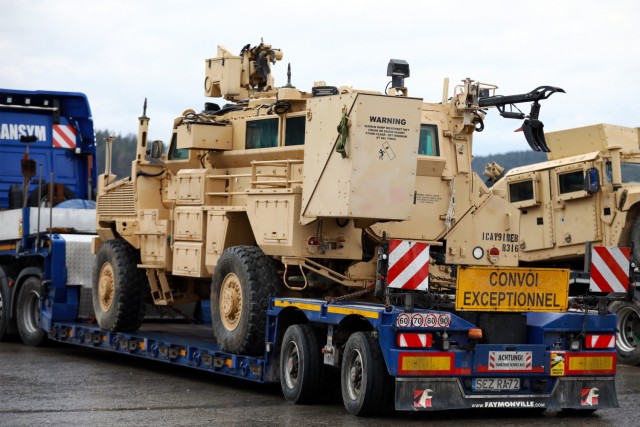 An armored vehicle assigned to the 1st Armored Brigade Combat Team, 1st Cavalry Division, sits on a flatbed trailer at Hohenfels Training Area, Germany, in preparation for transfer to Poland, Mar. 11, 2021.