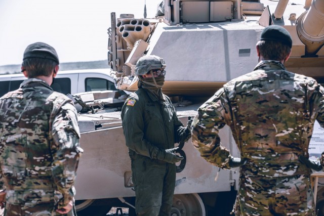 Spc. Shawnee Vercammen, a tanker with 3rd Armored Brigade Combat Team, 1st Cavalry Division briefs leaders from the British and French Army’s about the U.S. Army’s newest version of the Abrams Main Battle Tank, the M1A2 SEPv3, Fort Hood,...