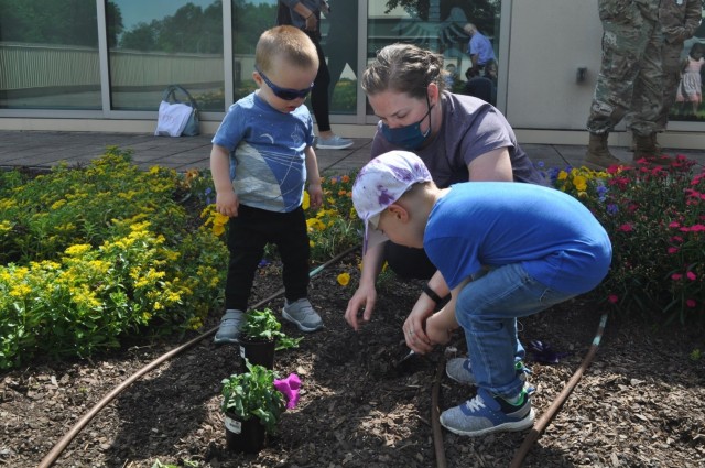 Martin Army Community Hospital celebrates Month of the Military Child by having our youngest heroes plant purple flowers.