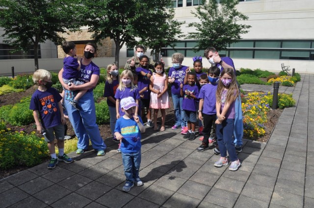 Martin Army Community Hospital celebrates Month of the Military Child by having our youngest heroes plant purple flowers.