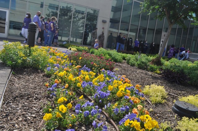 Martin Army Community Hospital celebrates Month of the Military Child by having our youngest heroes plant purple flowers.