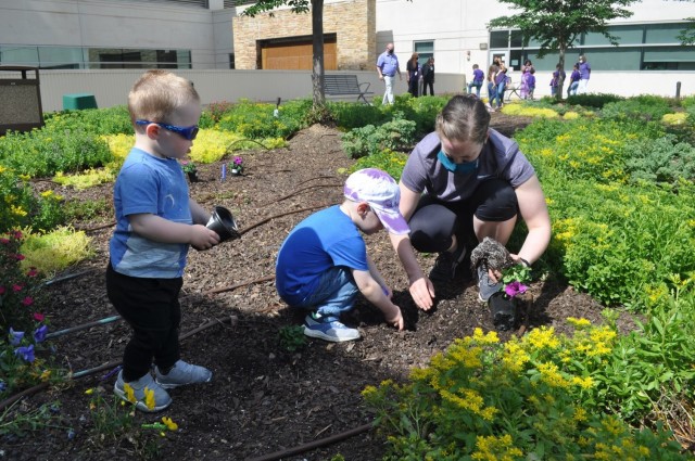 Martin Army Community Hospital celebrates Month of the Military Child by having our youngest heroes plant purple flowers.