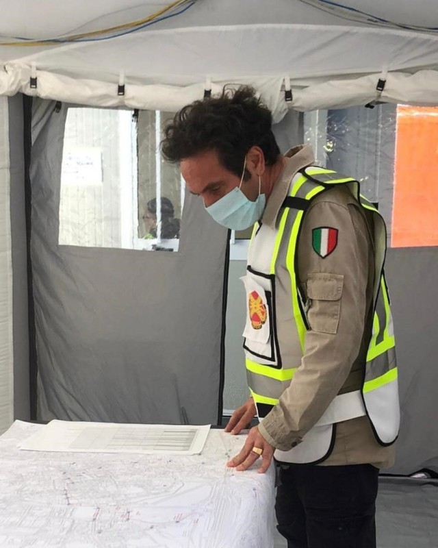 Host nation coordinator Antonio Quaglia reviews an evacuation map while supporting the U.S. Army Garrison operations’ team from the Vicenza’s emergency center May 2.  The garrison provided services to the 150 Americans forced to leave their...