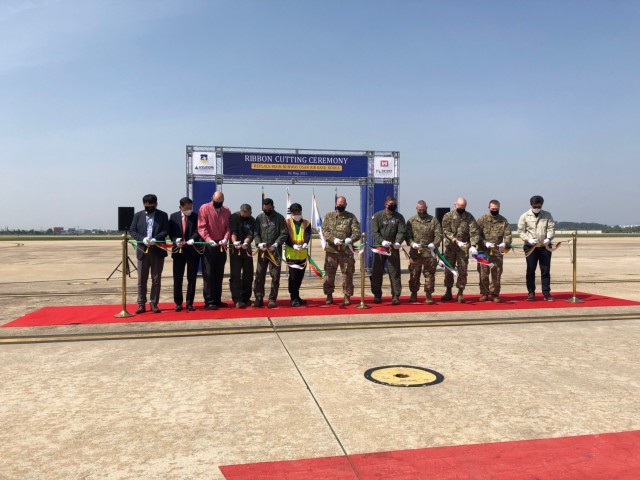 Col. Christopher Crary (Center) , U.S. Army Corps of Engineers (USACE), Far East District (FED) commander and Col. John Gonzales, 51st Fighter Wing commander, along with other dignitaries, conducted a ribbon cutting ceremony for the replacement of...