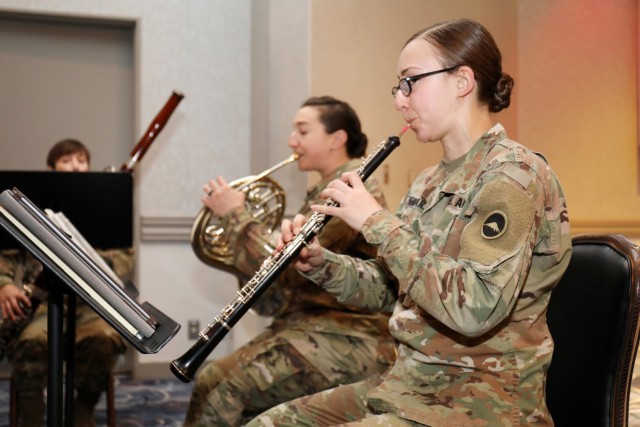 From right, Sgt. Lacey Semansky, Sgt. Caitlin Brody and Sgt. 1st Class Heather Harmon, members of the U.S. Army Japan Band’s Fuji Winds woodwind quintet, play during the National Day of Prayer Lunch at the Camp Zama Community Club, Camp Zama,...