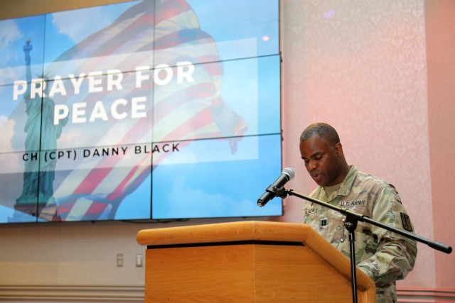 Chaplain (Capt.) Danny Black, chaplain for the 311th Military Intelligence Battalion, prays for peace during the National Day of Prayer Lunch at the Camp Zama Community Club, Camp Zama, Japan, May 3.