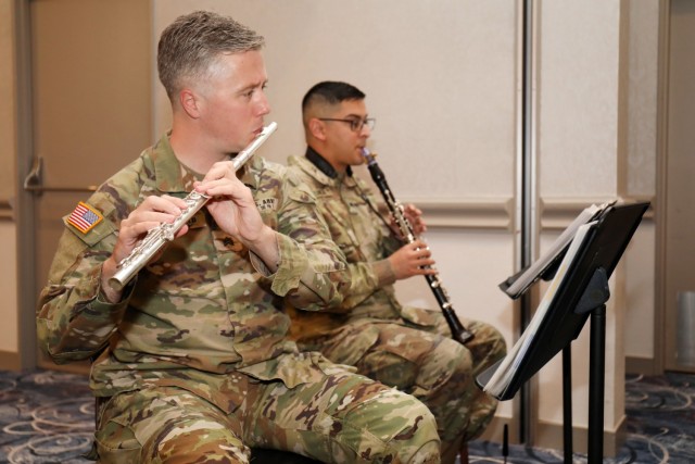 Sgt. Ryan MacDonald and Spc. Michael Zuniga, members of the U.S. Army Japan Band’s Fuji Winds woodwind quintet, play during the National Day of Prayer Lunch at the Camp Zama Community Club, Camp Zama, Japan, May 3.