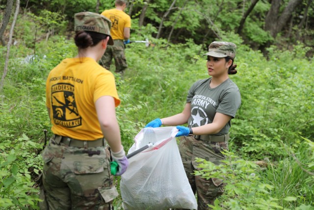 WICHITA, Kan. – Second-year Wichita State University Army Reserve Officer Training Corps cadet Alexandria Stegman, left, and first-year cadet Tammy Tran, right, both long-time Wichita residents, collect trash and debris at Glen Dey Park April...