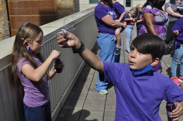 Eight-year-old Adam White and his younger sister Beth blow bubbles as part of Martin Army Community Hospital's Month of the Military Child celebration.