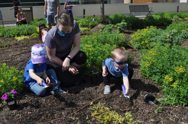 Martin Army Community Hospital celebrates Month of the Military Child by having our youngest heroes plant purple flowers.