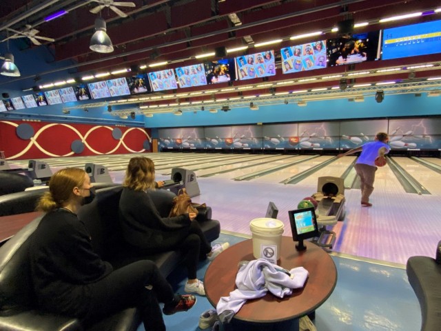 Kelly DeJardin (center) and her children enjoy family time at the bowling alley on Caserma Ederle May 2. The DeJardins are one of the 83 U.S. displaced families forced to leave their home when Italian officials evacuated downtown Vicenza to defuse...