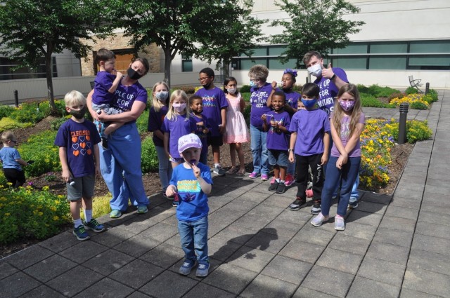 Martin Army Community Hospital celebrates Month of the Military Child by having our youngest heroes plant purple flowers.