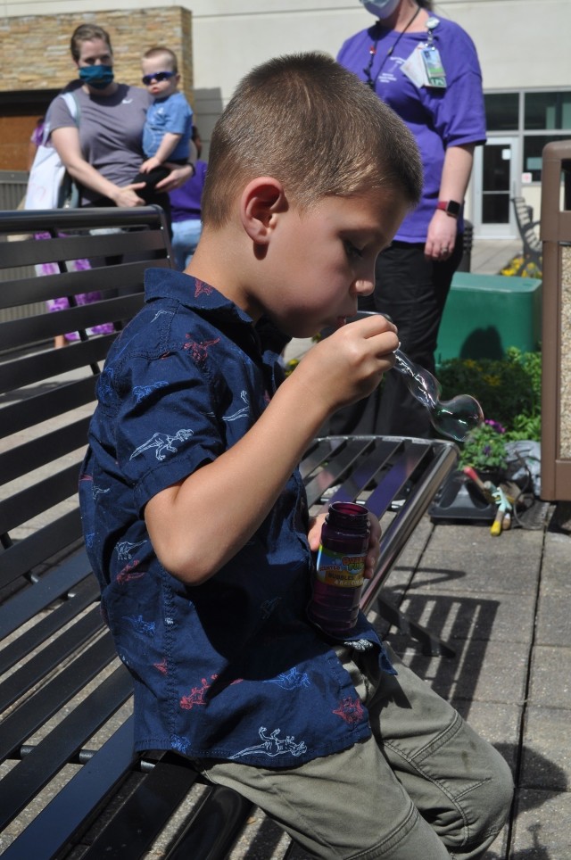 Five-year-old Cameron McDaniel blows bubbles as part of Martin Army Community Hospital's Month of the Military Child celebration.