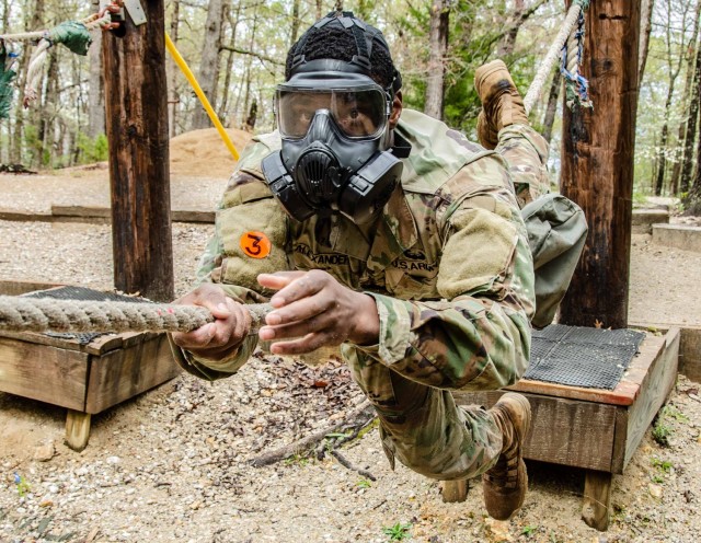 Staff Sgt. Aquai Alexander, Company A, 554th Engineer Battalion, competes at the Physical Endurance Course in a gas mask April 28. The addition of gas masks was a surprise element for the competitors. Alexander was named MSCoe Drill Sergeant of...