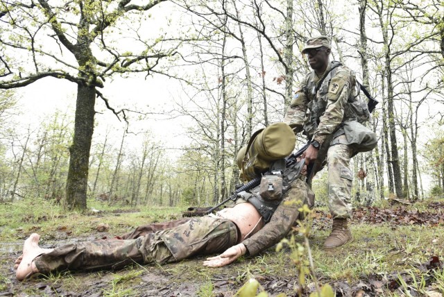 Sgt. 1st Class Curtis Hudson, Company B, 31st Engineer Battalion, performs a casualty extraction during the Expert Soldier Badge portion of the competition April 29 at Training Area 125.