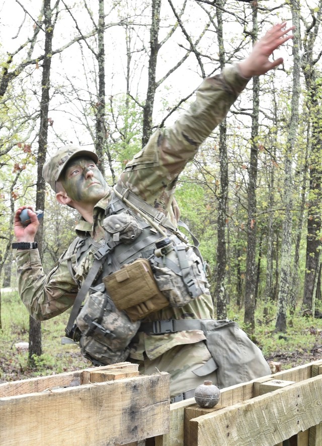 Pfc. Terrel Rechsteiner, Sapper Training Company, throws a grenade during the Expert Soldier Badge portion of the competition April 29 at Training Area 125. Rechsteiner was named MSCoE Soldier of the Year.