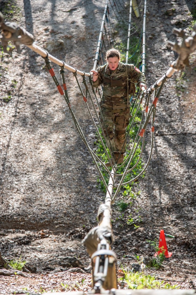 1st Lt. Madison Jones crosses a rope bridge during the Round Robin events May 1 at Training Area 98.