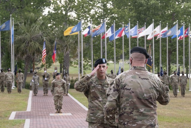 Command Sgt. Maj. Travis J. Wirth, senior enlisted leader for the 193rd Infantry Brigade, salutes Col. Mark Hutanen, the brigade's commander, for the first time during the unit's change of responsibility ceremony. Wirth assumed responsibility for...