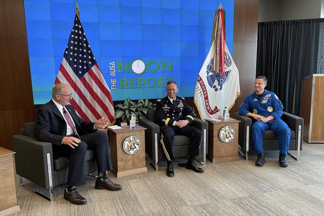 Retired Gen. Robert B. Brown, left, Association of the U.S. Army executive vice president, speaks with Lt. Gen. Daniel L. Karbler, commanding general, U.S. Army Space and Missile Defense Command, and Col. Andrew R. “Drew” Morgan, U.S. Army...