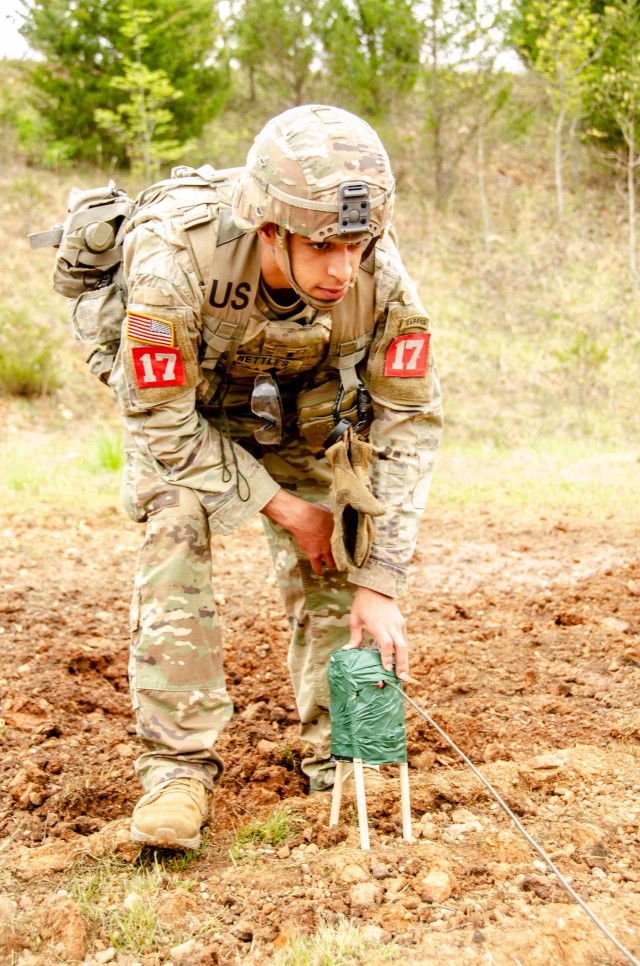 1st Lt. Jordan Nettles places an improvised shaped charge May 2 at Range 26.