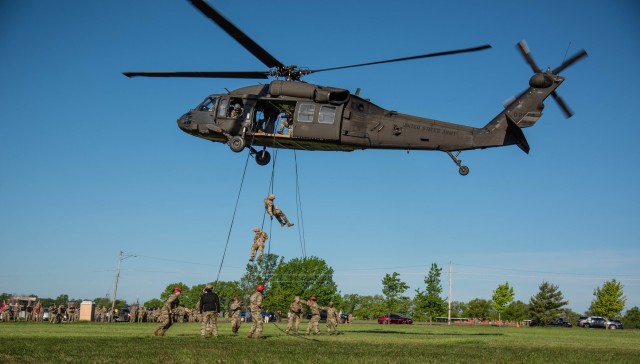 1st Lt. Joel Wilson and Sgt. 1st Class Louie Smith rappel from a UH-60 helicopter May 3 to kick off the X-Mile event near Gammon Field.