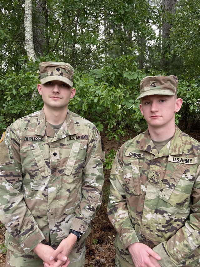 Spc. Charles Duplessis (left) and Pfc. Zachary Flowers (right), both combat medics with Weed Army Community Hospital, rendered care to a passenger on a flight from California to North Carolina April 8. Duplessis, a Charlotte, N.C. native, and Flowers, a Plain City, Ohio native, were traveling to a paramedic course when they were able to use their skills as Army medics to treat a man who suffered a seizure mid-flight. (Courtesy photo)