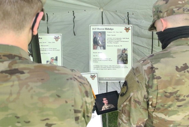 Class of 2023 cadets from Company C-3 watch a video of Maj. Lisa Beum, Army Cyber Institute public affairs officer, talking about 1st Lt. Daren Hidalgo during the 16th annual “Inspiration to Serve” Cemetery Tour April 29 at the West Point...