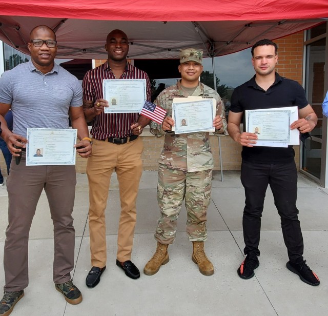 Left to right, originally from Mali, Spc. Aruna Sangari  from 1st Battalion, 5th Field Artillery Regiment, 1st Infantry Division; Spc. Gordon Akim Smith 3rd Battalion, 66th Armor Regiment, 1st Infantry Division is originally from Guyana. Staff...