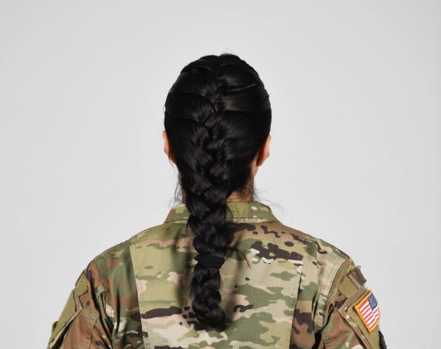 U.S. Army Soldier wearing new approved ponytail hair style. 
