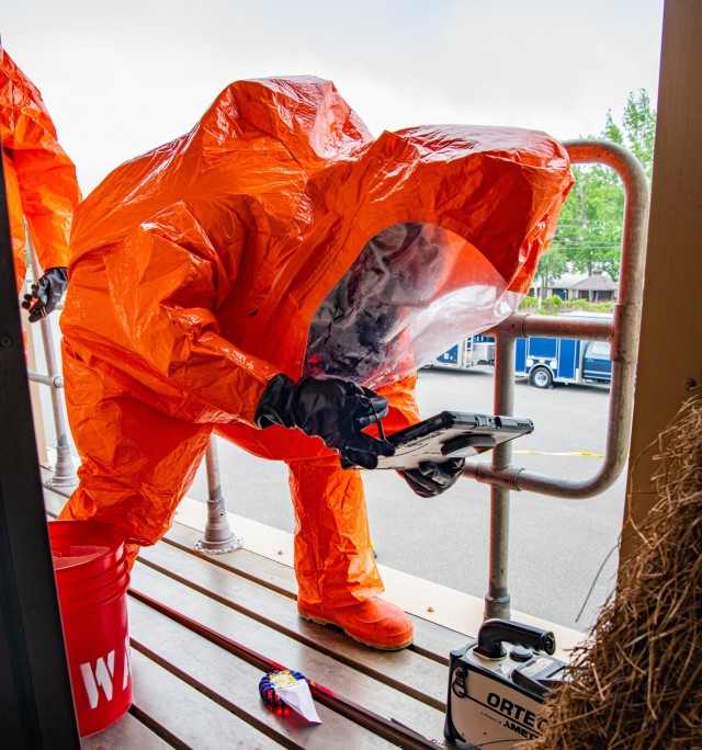 Air Force Staff Sgt. Gregory Kassner, a team member with the 44th Civil Support Team collects a sample of potentially hazardous material during a multi-CST exercise in Ft. Walton Beach, Tuesday May 4.