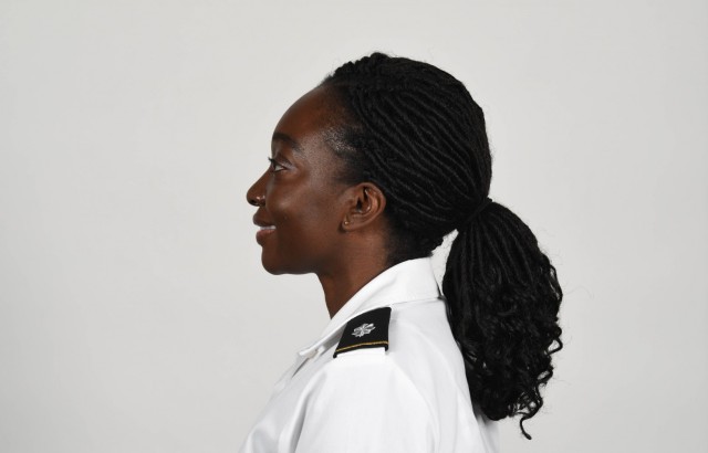 U.S. Army Soldier wearing new approved ponytail hair style. 