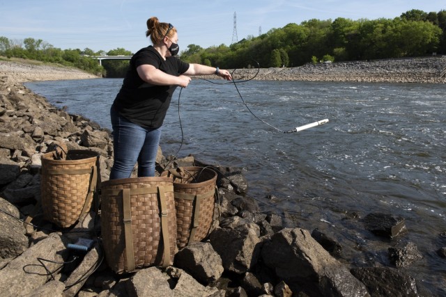 Sarah Pedrick, biologist in the U.S. Army Corps of Engineers Nashville District’s Water Management Section, puts a water quality instrument into the tailwater of the Stones River below J. Percy Priest Dam in Nashville, Tennessee April 27, 2021...