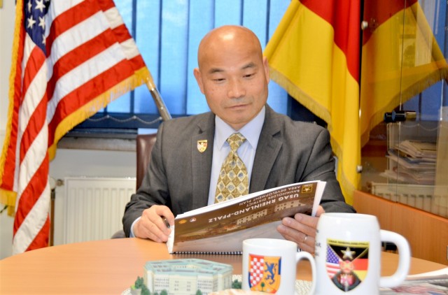 Jai Kim, Baumholder Military Community Deputy Garrison Manager, looks over costs and projections within the BMC from his office in Baumholder.
(Photo by Bernd Mai)