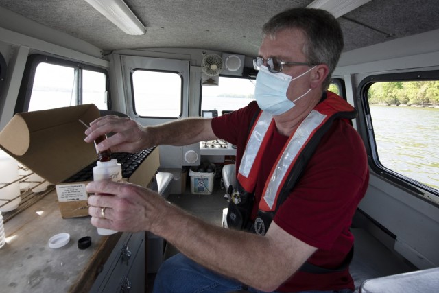 Mark Campbell, hydrologist in the U.S. Army Corps of Engineers Nashville District’s Water Management Section, puts a preservative into a chlorophyl sampling on a survey boat in J. Percy Priest Lake in Nashville Tennessee April 27, 2021. (USACE...