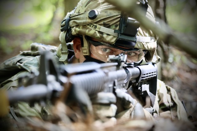 Staff Sgt. John Worst, a squad leader assigned to the 300th Chemical Company, 485th Chemical Battalion, 76th Operational Response Command, keeps an eye out for enemy movement during unit training operations at the Joint Readiness Training Center in Fort Polk, Louisiana, April 10, 2021.  