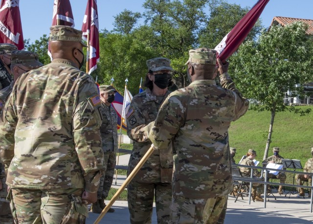 
Outgoing commander, Brig. Gen. Wendy L. Harter, passes the colors to Lt. Gen R. Scott Dingle, commander of U.S. Army Medical Command and The Surgeon General, during the Regional Health Command-Central change of command ceremony May 5 on Joint Base San Antonio-Fort Sam Houston.

