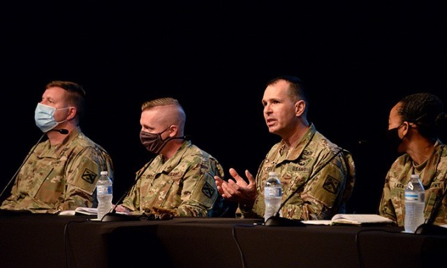 Chief Warrant Officer 5 Steven Kilgore, command chief warrant officer for the Combined Arms Center, third from the left, explains what a warrant officer is to members of the 2021 Leadership Kansas Class during an informational panel about the Army...