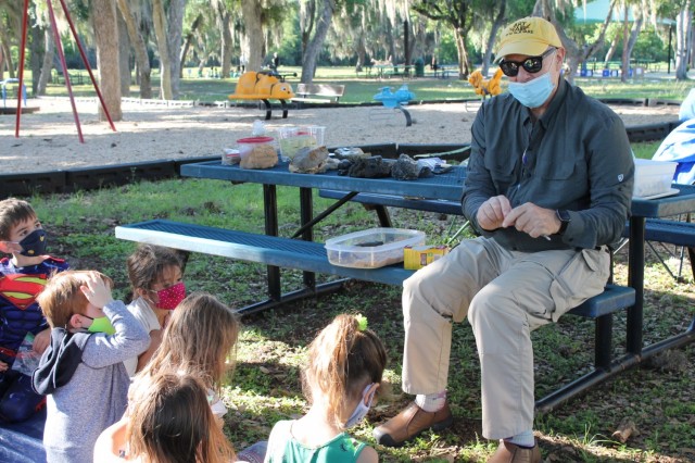 Scott Weber, a geologist, asks children if they know the definition of geology at the Geology station during the U.S. Army Environmental Command Nature Walk held for about 140 kindergarteners from the Fort Sam Houston Elementary School.