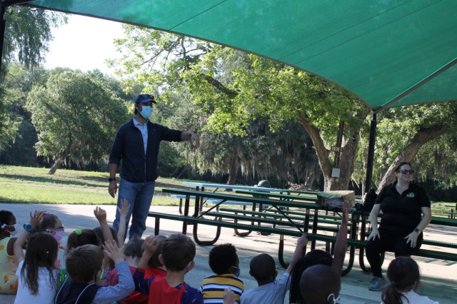 Sam Klein, a civil engineer, and Jennifer Rawlings, an environmental scientist, talk to the children about recycling at the Recycling station during the U.S. Army Environmental Command Nature Walk held for about 140 kindergarteners from the Fort Sam Houston Elementary School.