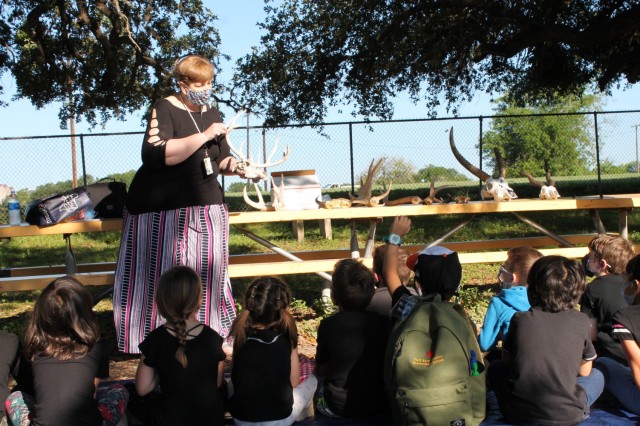 Cathy Kropp, a public affairs specialist, runs the Horns and Antlers station at the U.S. Army Environmental Command Nature Walk held for about 140 kindergarteners from the Fort Sam Houston Elementary School.